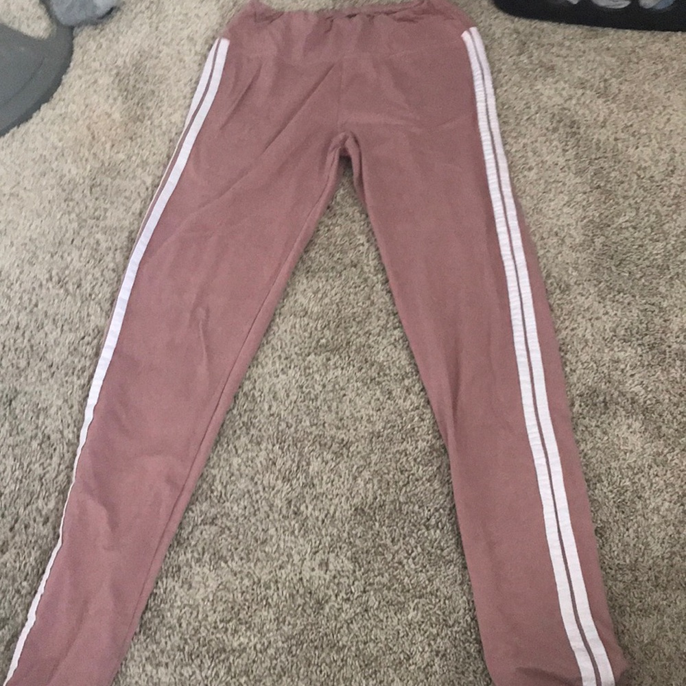 Blush colored leggings with white stripes